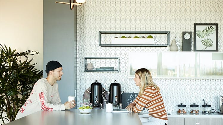 Two people drinking coffee