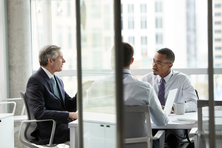 Men sitting together in a meeting.