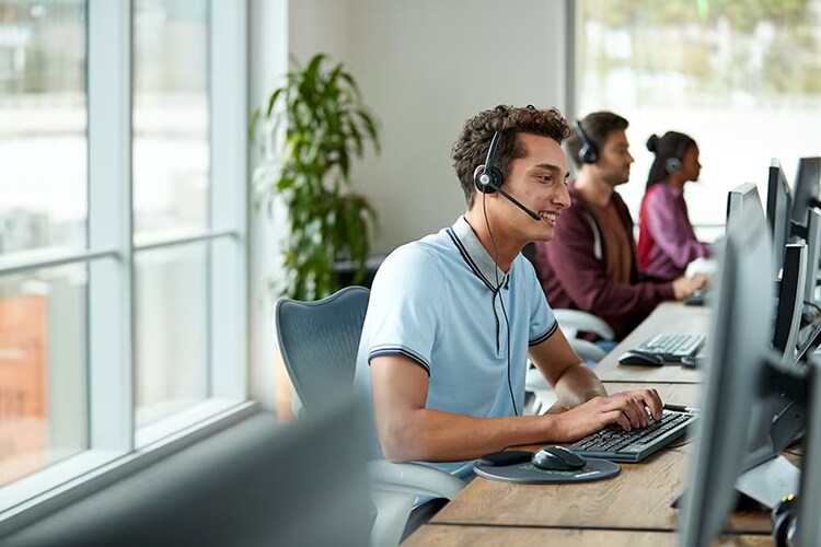 Man at computer talking