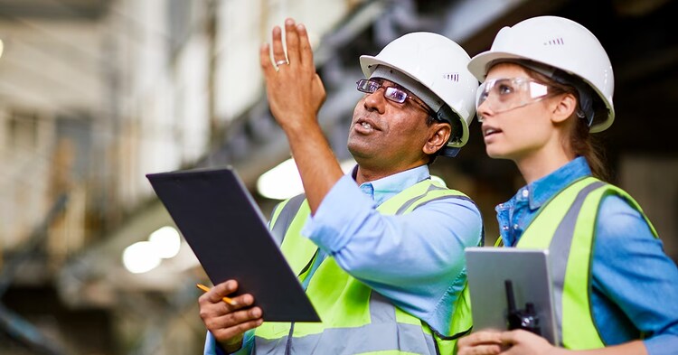 MAle engineer showing the project to his colleague