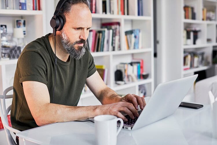 Middle aged man working from home.