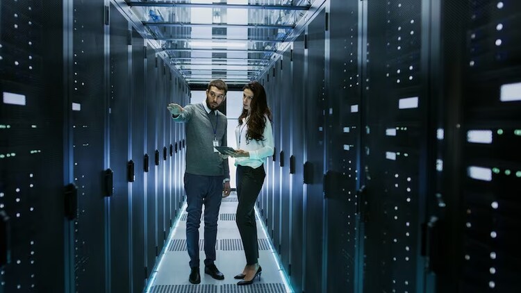 Man and woman talking in server room