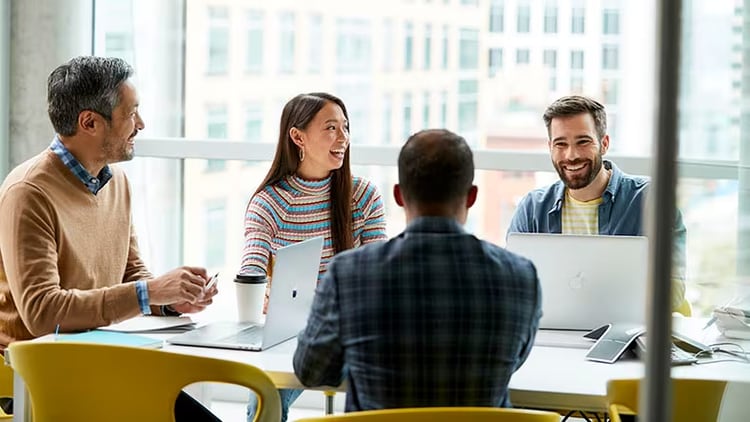 4 happy employees: Enterprise Service Management improves productivity and breaks down silos for a better employee experience.