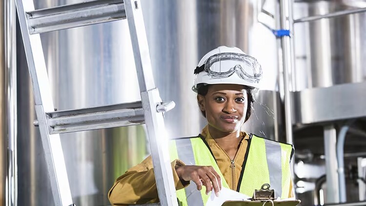 Woman holding clipboard industry