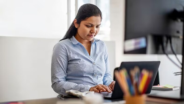 Citizen developers: A businesswoman works on a laptop.