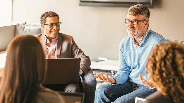 Business people talking in an office meeting