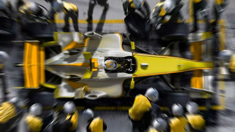 Hyperautomation: yellow racecar at pit stop