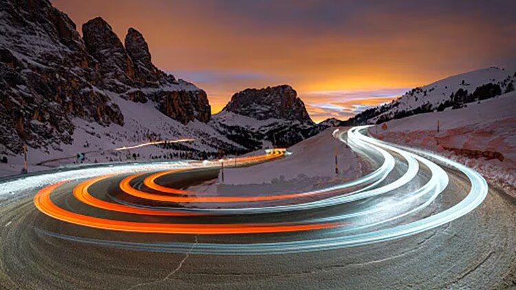 Service operations drive fast resolution of IT issues: time-lapsed photo showing fast car movement on mountain pass