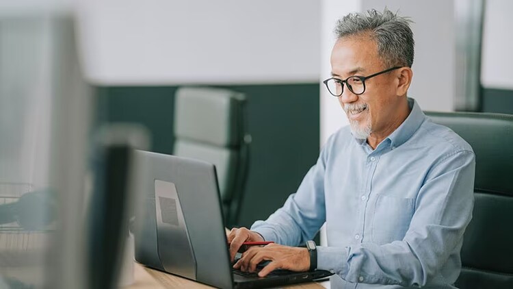 Customer efficiency innovations: man typing on a laptop