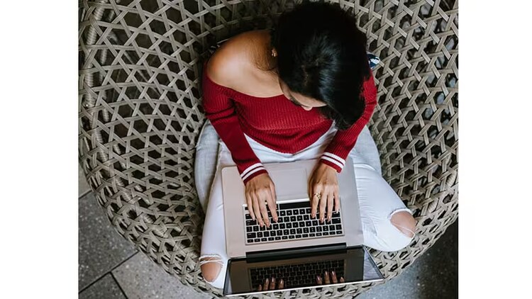 Working on a Now Platform release: female Indian developer working on a laptop