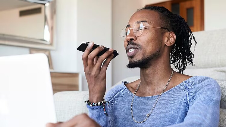 Artificial intelligence: A man speaks into a cellphone.