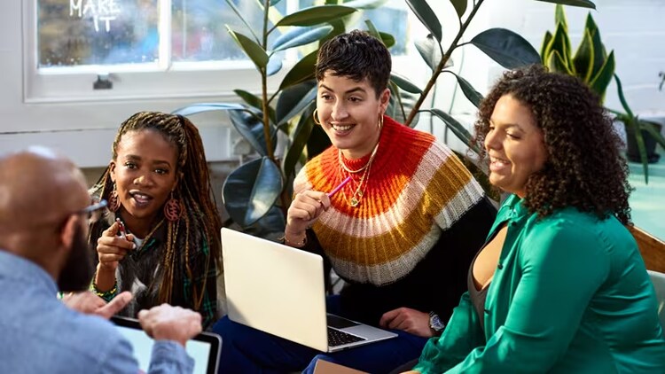 DEI data analytics: group of diverse workers in conversation