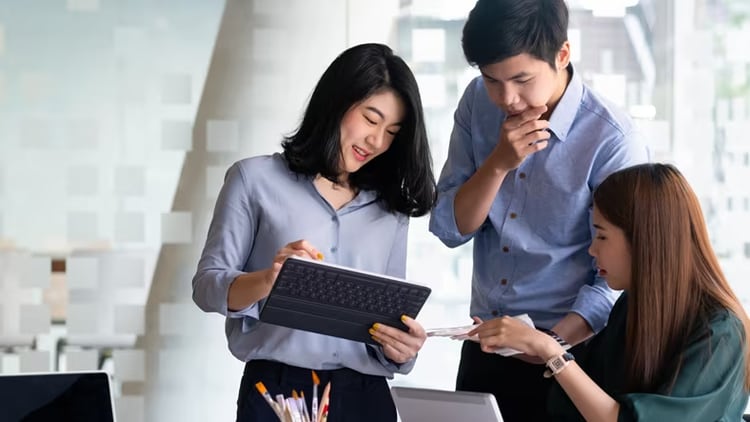 Risk-readiness and organizational resilience: 3 workers collaborating in an office