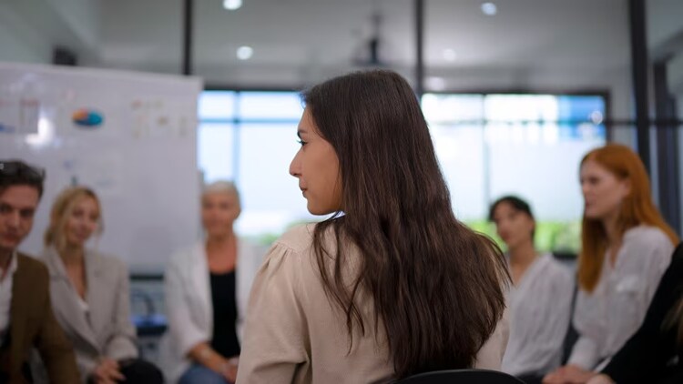 hyperautomation strategy: back of a woman in a circle of young workers