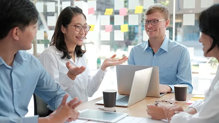 Experience strategy: group of workers discussing business