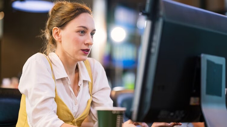 Generative AI trust: woman intently working at computer