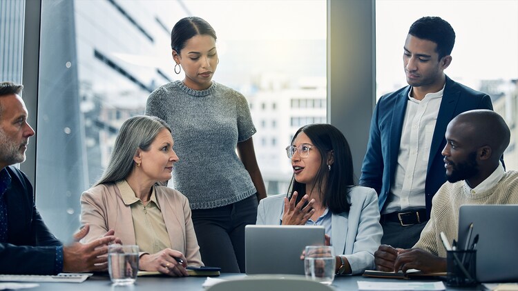 Platform governance: 6 workers collaborating around a conference table