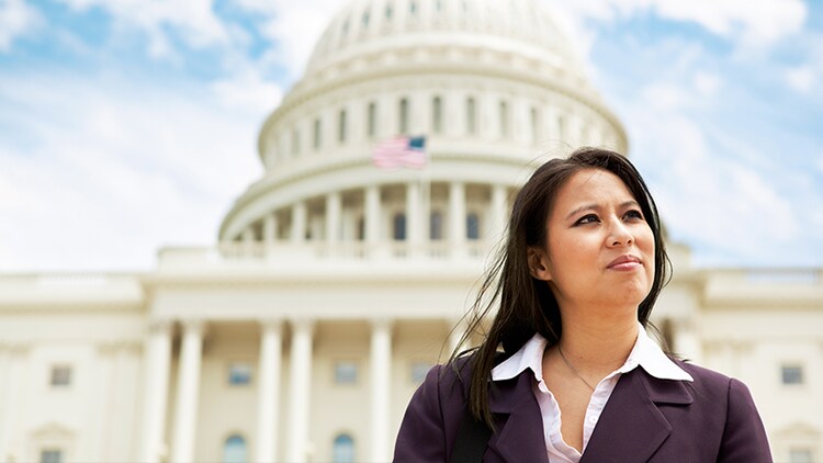 Government services: woman standing in front of the U.S. capitol building