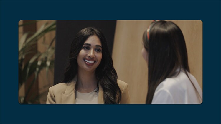 Career growth plan: ServiceNow employee Deepika V. smiling at a co-worker
