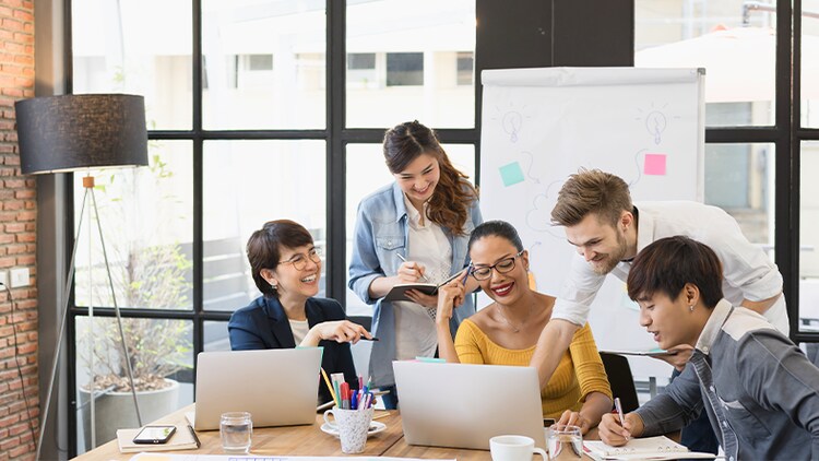 Product mindset: group of employees working together in a conference room