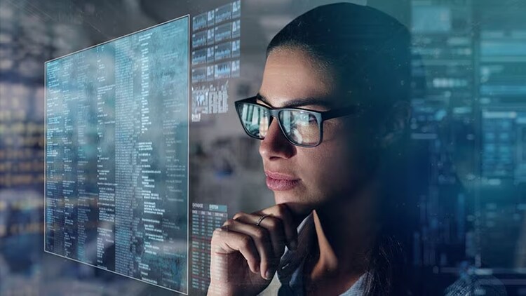 Large language model: a woman staring at computer screens full of data