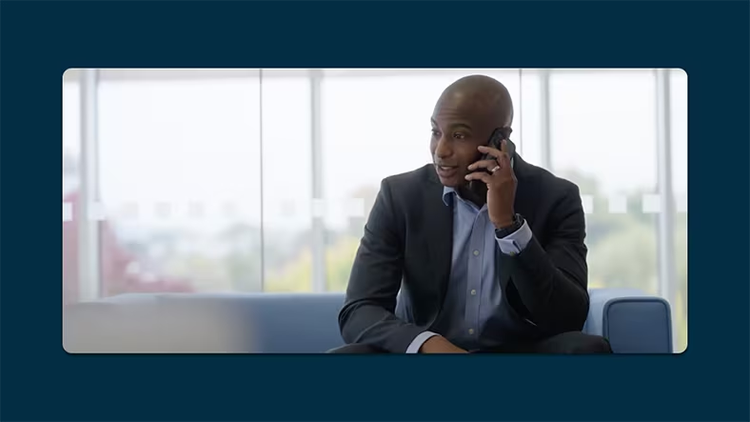 Career development: ServiceNow employee Marcel A. holding a phone to his ear