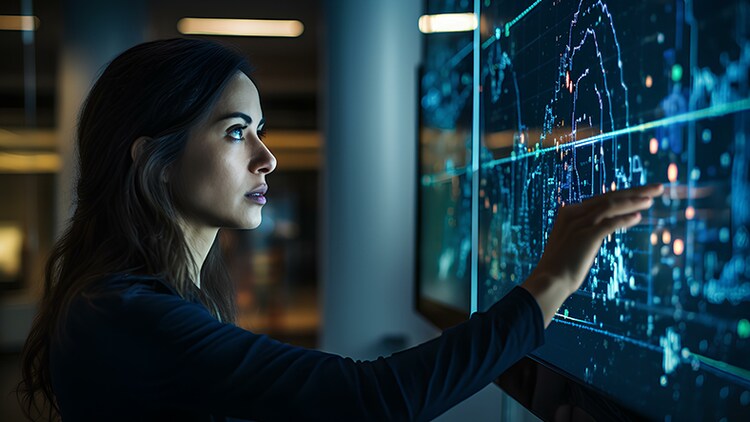 AI-first organizations: woman tapping a large computer screen