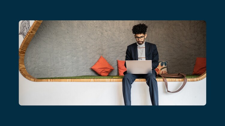 ServiceNow Platform security: person working on a laptop in an office alcove