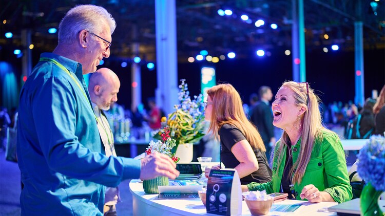 People conversing at the Knowledge Expo