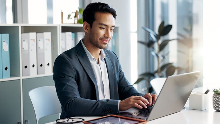 AI strategy: man working on a laptop in an office