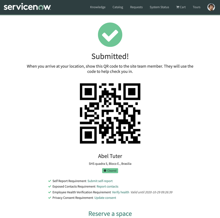 Health verification confirmation screen with QR code, instructions, and a link to reserve a workspace.