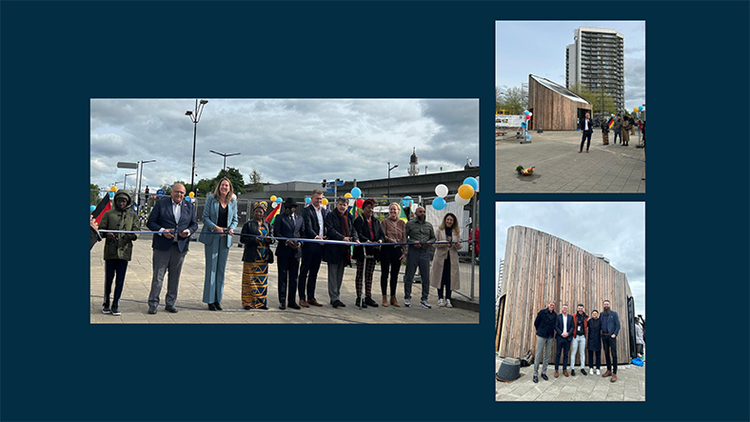 Mensen vieren de opening van de Buurttransitiehub in Amsterdam-Zuidoost