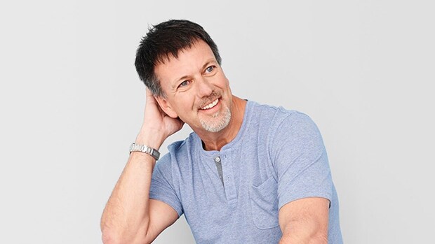 Woman working online on a laptop in a coffee shop