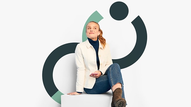 Smiling woman holding a smartphone