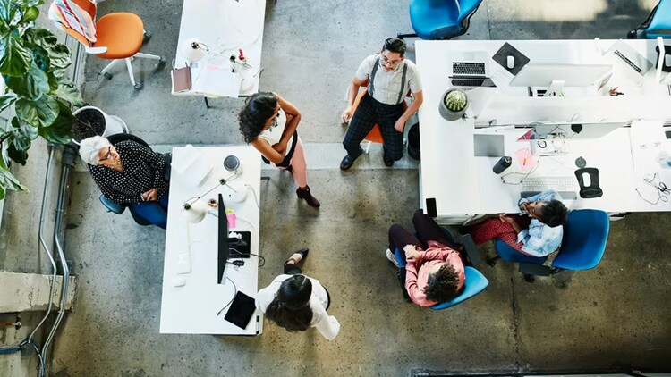 Service Graph Connector: overhead shot of workers collaborating