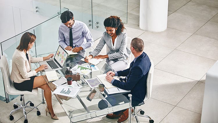 Risk-ready: a group of workers gathered around a conference table