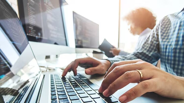 Business resilience: Two people working from computers