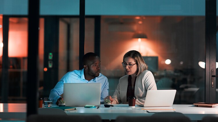 Agentic AI for ServiceNow: two people working together with laptops in an office